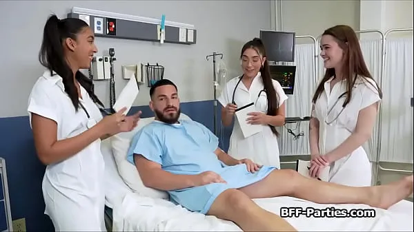 Vídeos de Three doctors performing a special check up on a handsome patient clips calientes